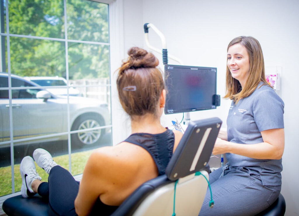 A woman getting information about her oral surgery